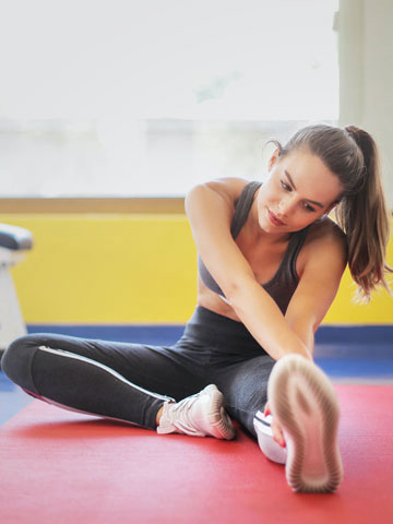 Home Yoga trainer guiding a wellness session at a physiotherapy center in Tohana