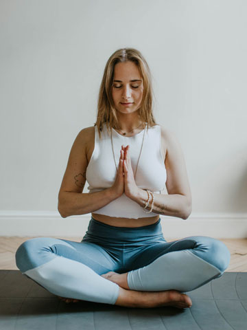 Home Meditation trainer guiding a mindfulness session at a physiotherapy center in Tohana