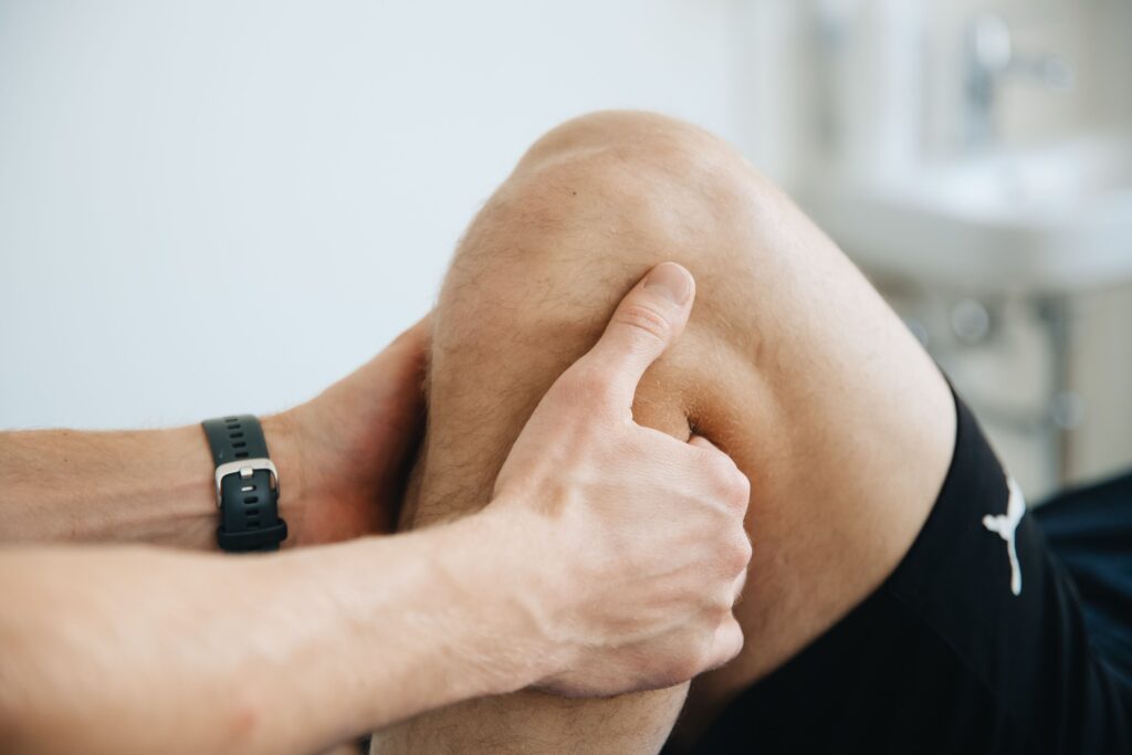 Physiotherapist providing knee treatment at a physiotherapy center in Tohana