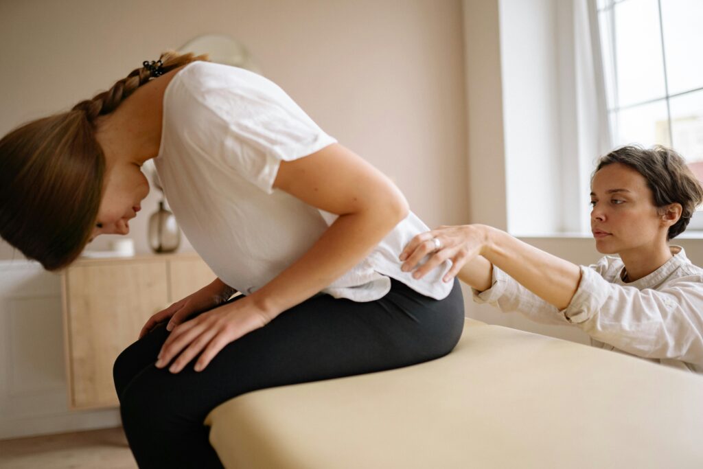 Physiotherapist providing back therapy to a patient at a physiotherapy center in Tohana