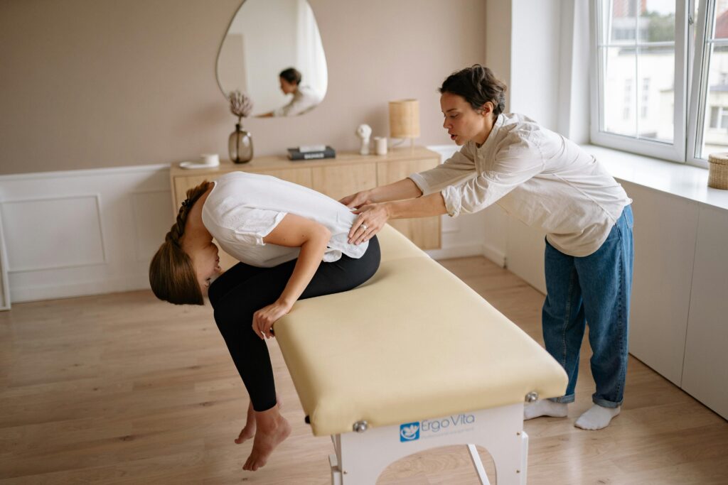 Physiotherapist providing a relaxing back massage at a physiotherapy center in Tohana